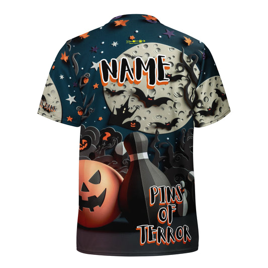 Halloween-themed t-shirt with pumpkins, bats, and a bottle labeled 'Pins of Terror' on a dark background.